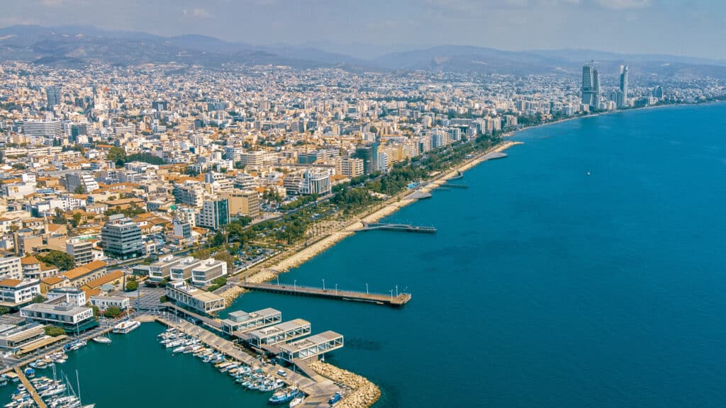 Aerial view of Limassol's coastline and skyline today, anchored by Molos Park