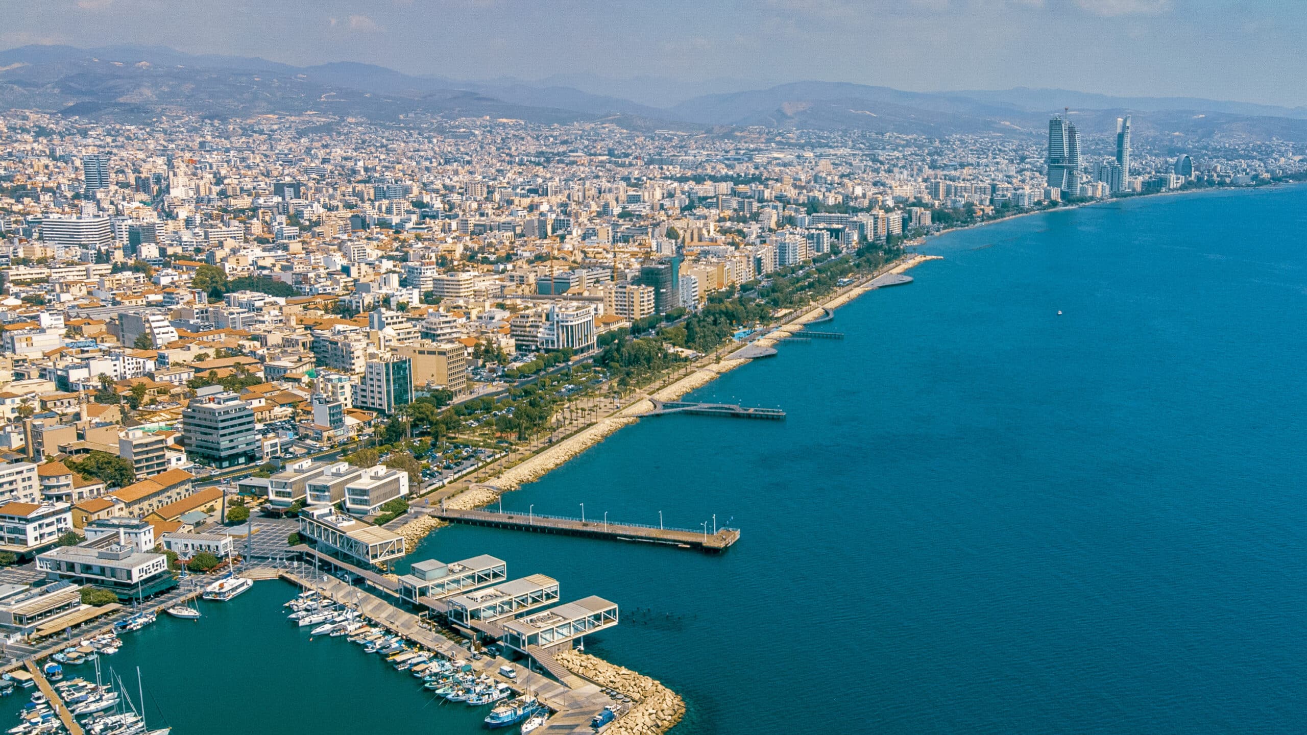 Aerial view of Limassol's coastline and skyline today, anchored by Molos Park