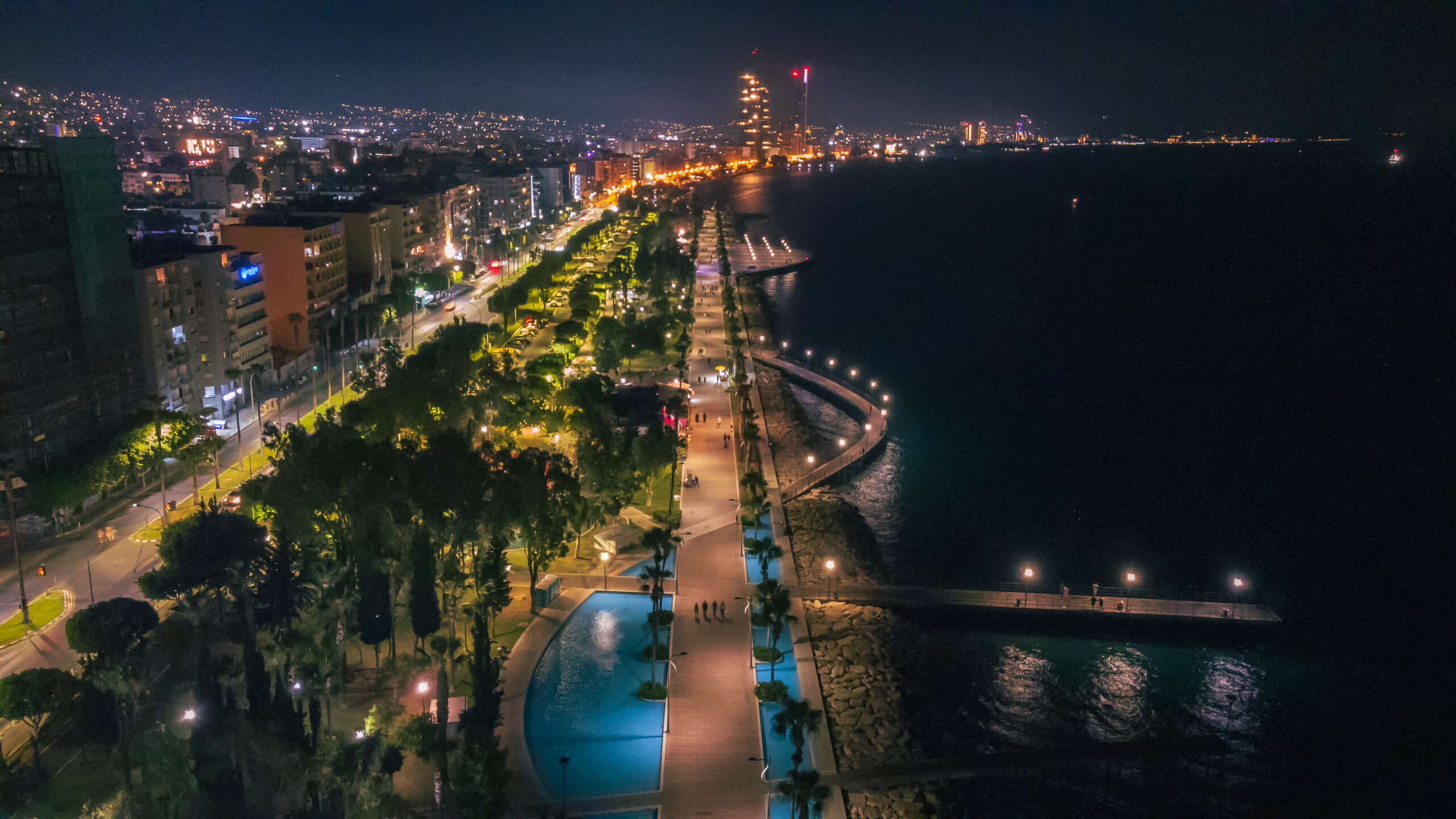 Night view of Limassol's promenade and skyline by the sea