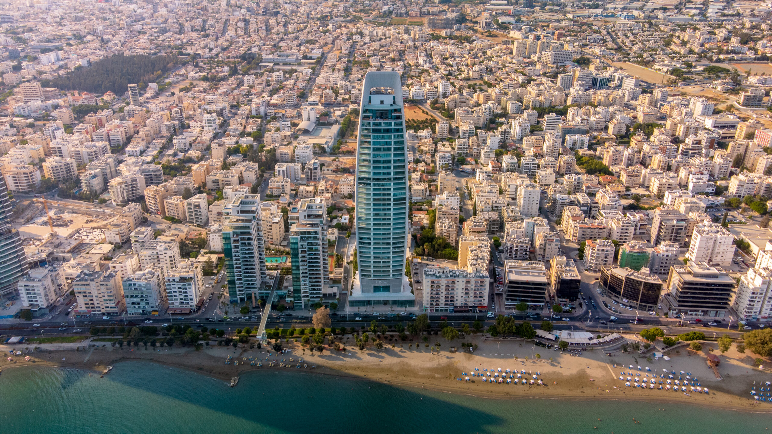 Aerial drone shot of a residential tower on the Limassol coastline